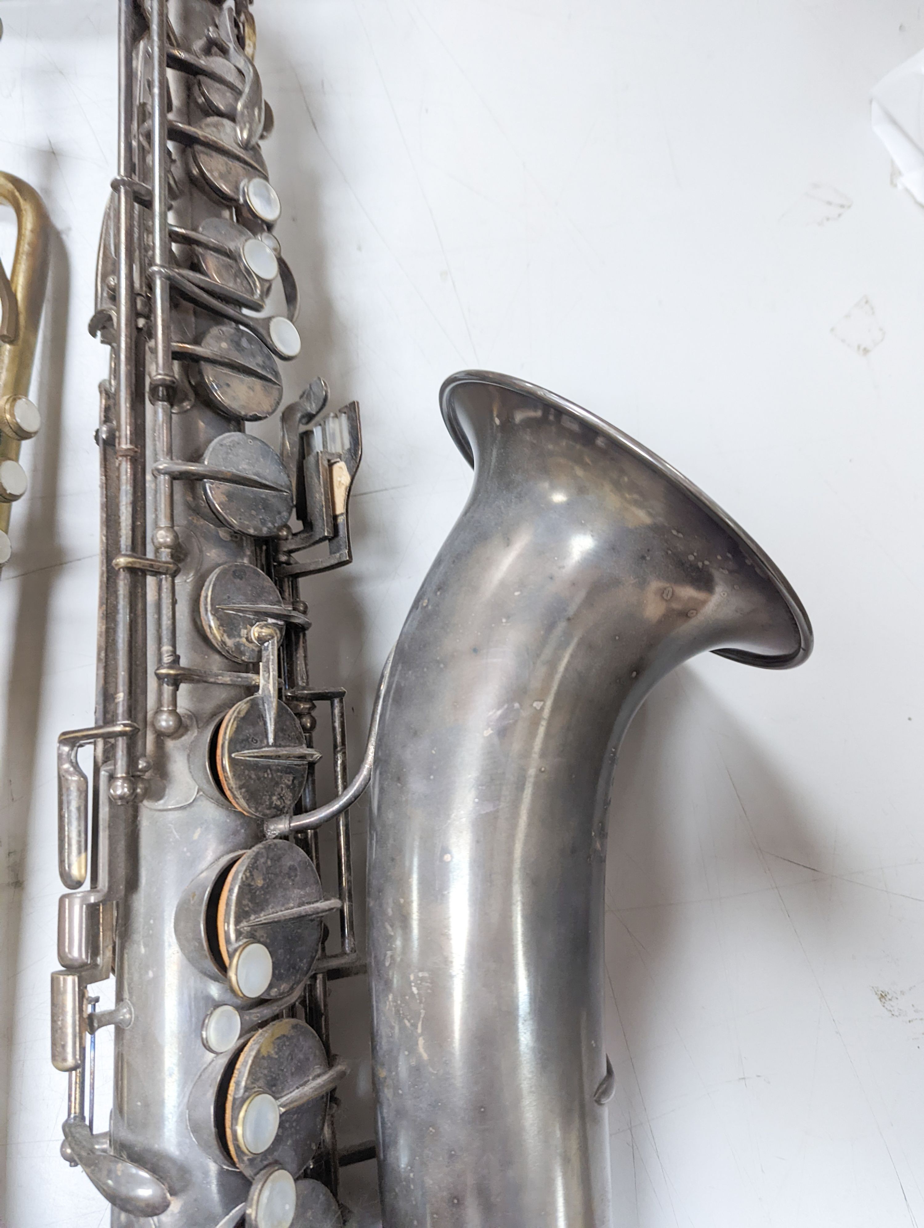 An Excelsior sonorous class A Hawkes & Son saxophone, and a Grafton Dallas, London trumpet with accessories